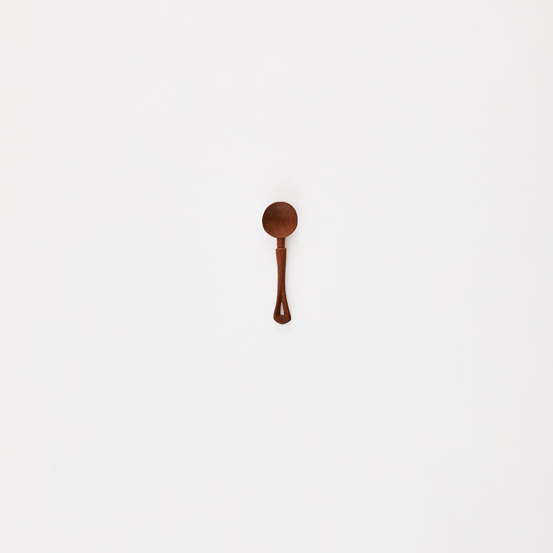 Dark wooden spoon.