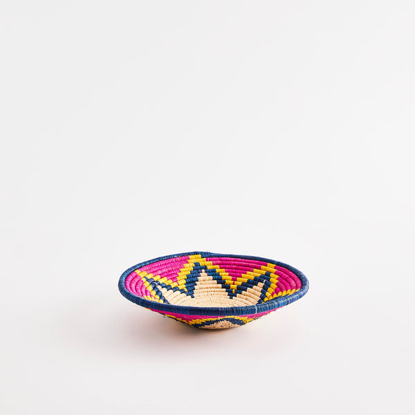 Pink, blue and yellow star design woven basket.