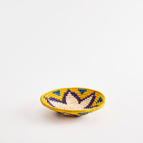 Yellow and blue star design woven basket.