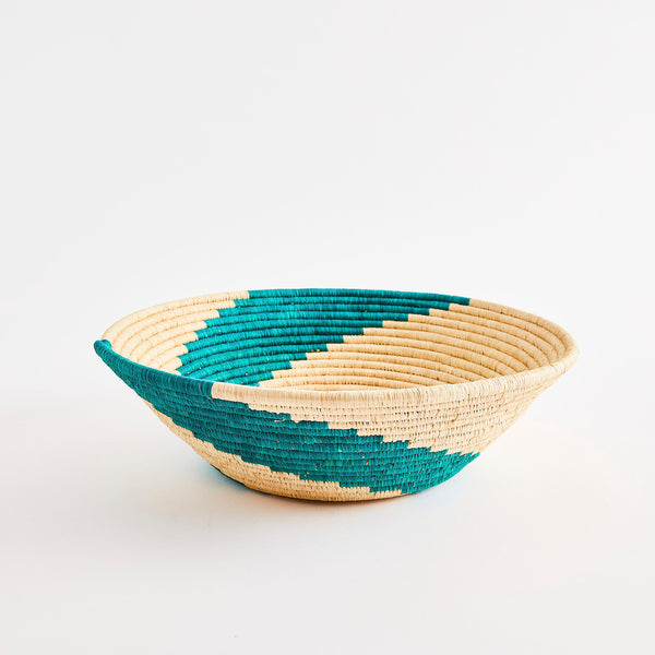 Turquoise striped woven basket.