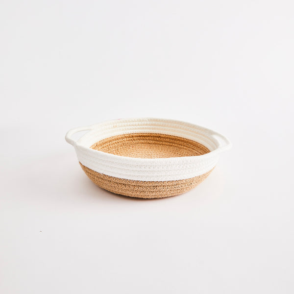 Woven basket with white rim. 